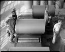 Rolls of newsprint with workers, 11/1952, #26946_1