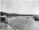 Standard Oil dock on river, 9/10/1953, #27701A_1