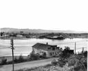 Creech Bros. and Strand Fisheries docks on river, 9/10/1953, #27702B_1