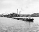 Tugboats A. G. HUBBLE and RANGER with a bundle log raft near Grays Harbor Mill, 12/1/1955, #30251_1