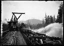 Log dump with steam engine, circa 1910, #G0359_1