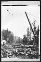 Loggers at log deck with donkey engine, copy from print, circa 1910, #G0383_1