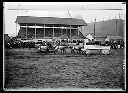 Draft horse team and Smith's Dairy wagon in front of fairground grandstand, circa 1920, #G0470_1