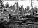 Two men and house by log pond, circa 1915, #G0632_1