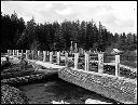 Bridge and log pond, circa 1920, #G0637_1