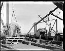 Three men with hoisting equipment, circa 1920, #G0719_1