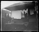 Small child with broom and clothes line, circa 1907, #G0790_1