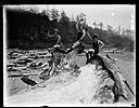 Three bathing beauties on driftwood, circa 1922, #G0943_1