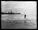 TENPAISAN MARU aground, crewman comes ashore on breeches buoy, 11/24/1927, #G1144_1