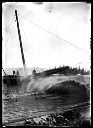 Log splashing into log pond, circa 1915, #G1376_1