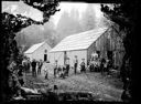 Group of men in front of buildings, possibly a logging camp, circa 1905, #G0683_1