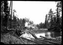 Locomotive and log dump, circa 1907, #G1267_1