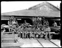 Group of men on lumber pile, circa 1910, #G1402_1