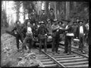 Men on railroad tracks with bottles and railcars, circa 1910, #G1429_1