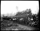 Loggers with log on railroad carriage, Camp 3, Polson Logging Co., circa 1915, #G1440_1