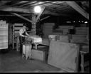 Wrapping bundles at Posey Manufacturing Company, 3/19/1931, #G1481_1