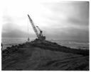 North jetty progress, clamshell crane placing rock, 8/12/1975-8/15/1975, #62433_1