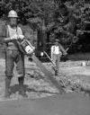 Donkey engine and loggers with contemporary and vintage clothing and equipment, 5/26/1982, #67734_1