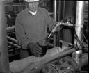 Worker in Rayonier plant interior, 8/1985, #69483_1