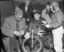 Scotchlite taping of bicycles at McDermoth School, 11/26/1955, #30236_1