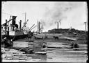 Loading lumber on ships, circa 1910, #L360025_4