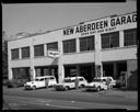 New Aberdeen Garage exterior with ambulances, drivers, and tow truck, 7/25/1959, #34712_1