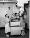 Woman with medical equipment, circa 1959, #35546_1