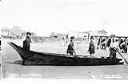 Native Americans and canoe at Taholah, circa 1915, #L400401_1