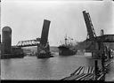 ORINOCO and tug TYEE passing under drawbridge, circa 1935, #L400407_1