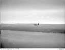 Unidentified amphibious aircraft in flight, 9/1/1948, #L31R14F2_1