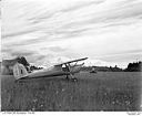 Aircraft at a rural grass airstrip, 7/4/1948, #L31R6F36_1