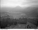 Unidentified farms, fields and roads in a valley surrounded by forested hills, 8/9/1948, #L31R9F12_1