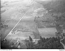 Unidentified farms, fields and roads in a valley surrounded by forested hills, 8/9/1948, #L31R9F2_1