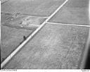 Unidentified farm, field and roads with bales of hay, 8/9/1948, #L31R9F9_1