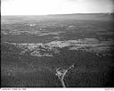 Unidentified timber lands with road and mountains in the distance, circa 1949, #L32R24F2_1