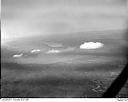 Clouds above an unidentified body of water, possibly Puget Sound, 6/27/1948, #L32R32F1_1