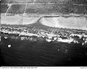 Ocean beach and surf near an unidentified creek and homes, circa 7/1949, #L32R34F20_1