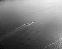 A pair of waterskiers behind a speedboat, circa 7/1949, #L32R34F9_1