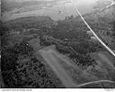 Airstrip at Summit with four small planes in flight, 9/4/1949, #L32R35F4_1